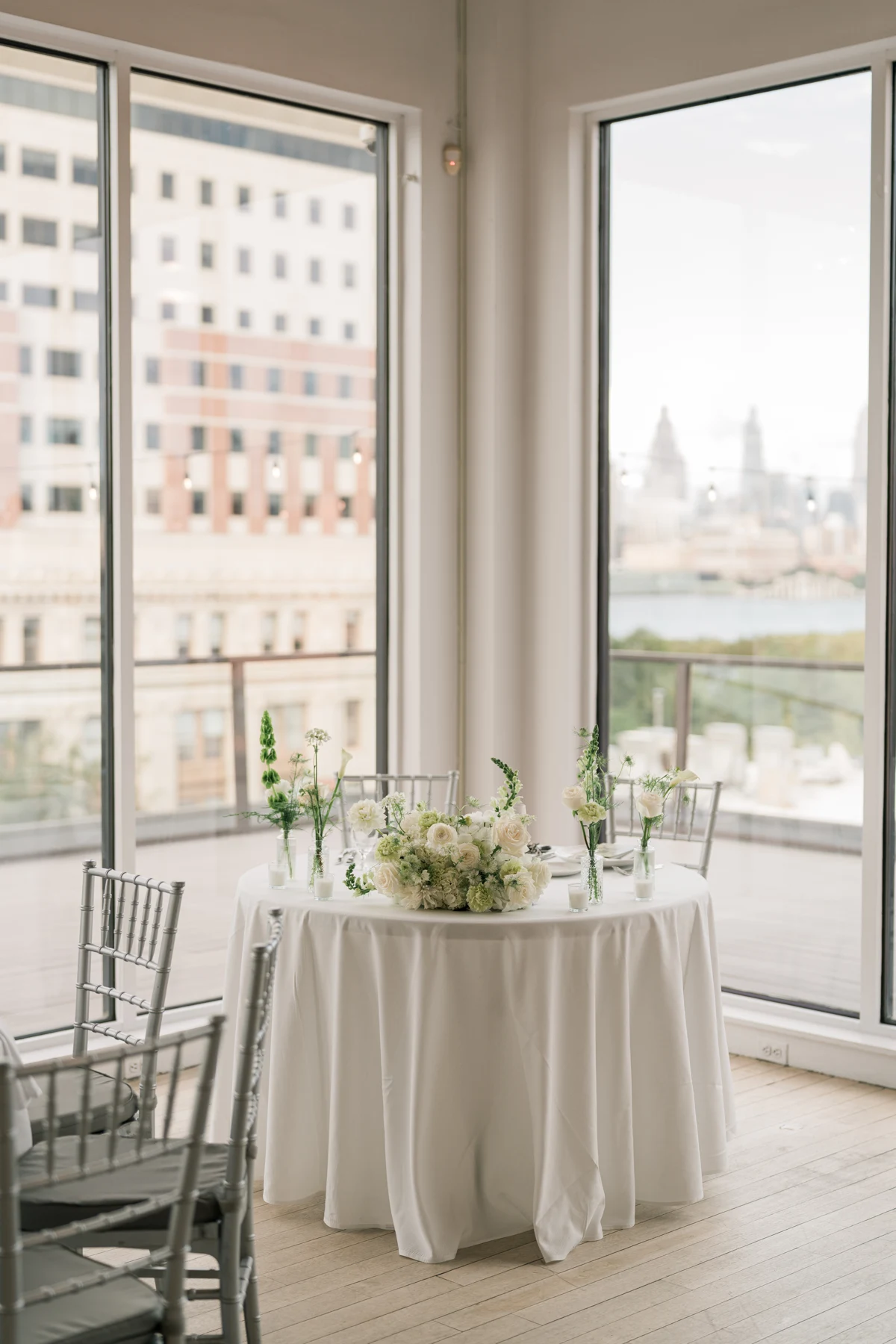 White and green flowers in a sunlit reception space