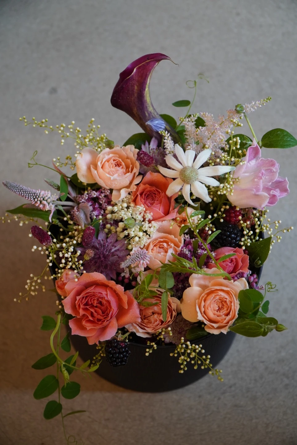 Seasonal flowers in rose, orange and burgundy