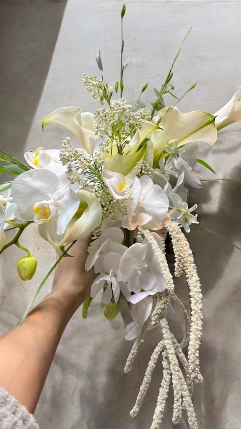 Airy white bouquet with cascading botanical details